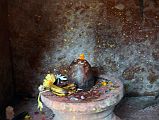 Kathmandu Changu Narayan 32 Shiva Lingam In Small Temple In North East Corner Of Changu Narayan A Shiva lingam sits inside the small temple in the north east corner of Changu Narayan to the right of the compound entrance.